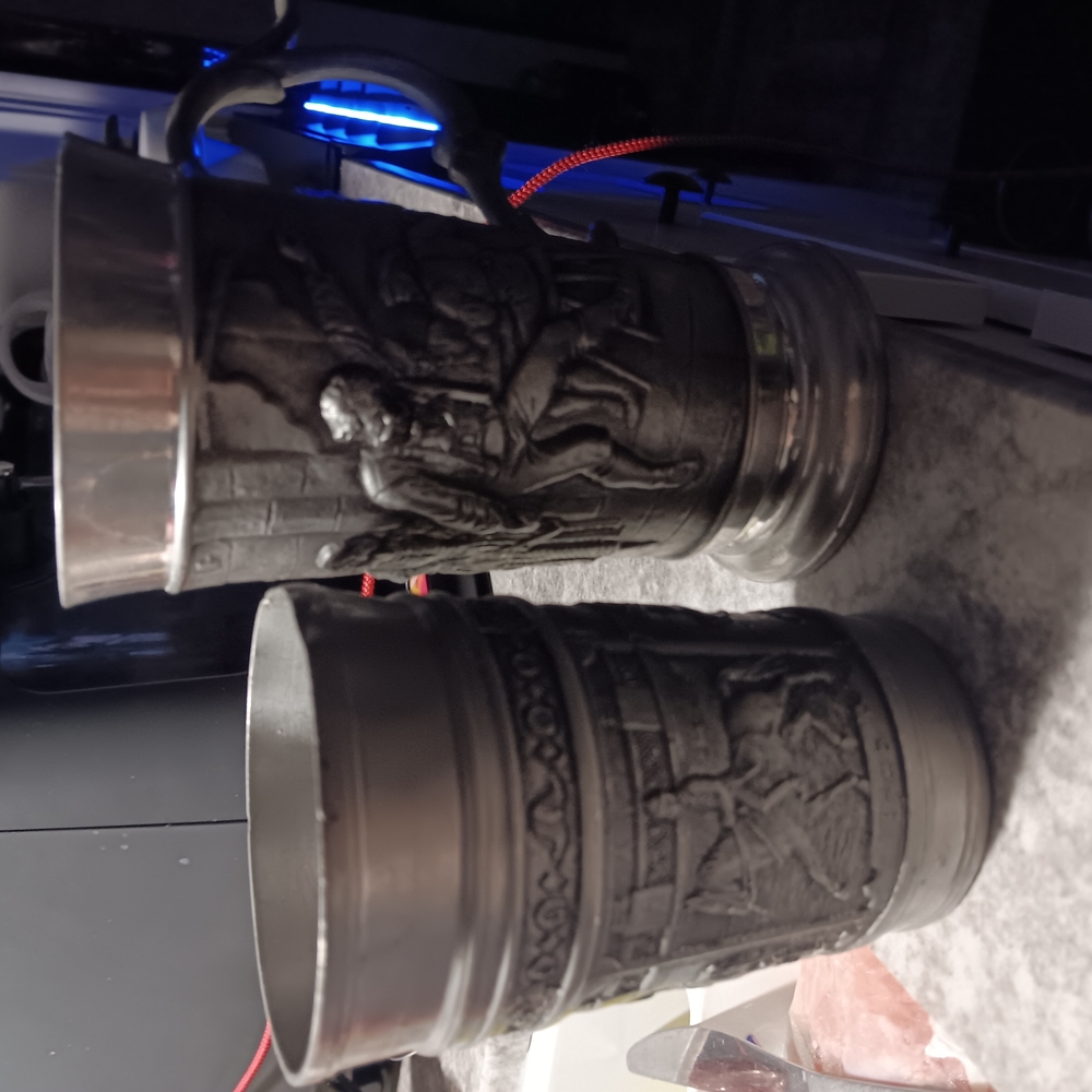 Vintage Silver Tankards with Intricate Designs
